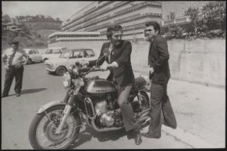 Actor Federico Martignoni with club owner Paolo Vassallo on a motorbike during the Number One night club drugs scandal


