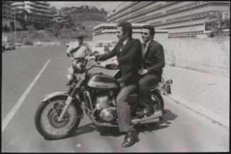 Actor Federico Martignoni with club owner Paolo Vassallo on a motorbike during the Number One night club drugs scandal

