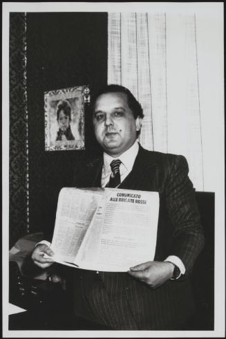 Giovanni Furfano holds up a Red Brigades press statement