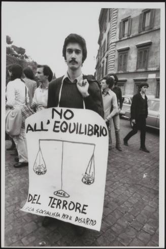 A man wears a protest placard that reads- 'No balance of terror. Socialist League for Disarmament'
