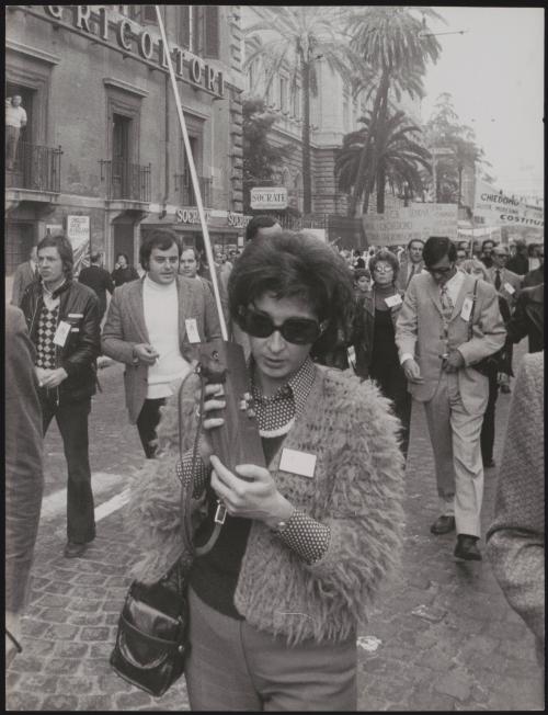 Woman with a walkie talkie on a protest march