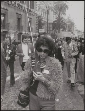 Woman with a walkie talkie on a protest march