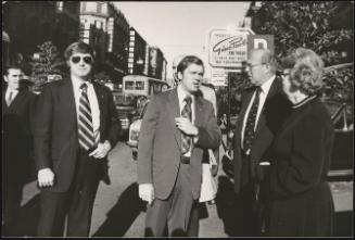 American politician Arthur Schultz flanked by bodyguards