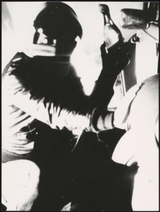 Rioter with petrol bomb