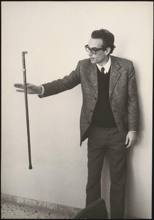 Professor Mareo Nicoletti holding out a walking stick