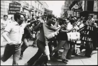 A crowd of protesters demonstrating in aid of strikes in factories. 