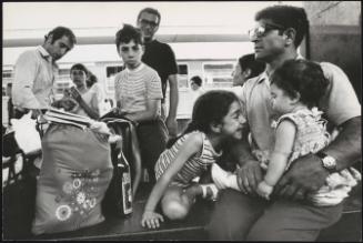 A family waiting at Termini train station in Rome