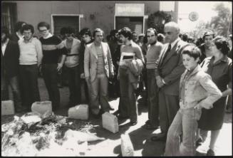 Mourners gather to pay their respects and flowers are laid at the spot where student Settimio Passamonti was killed on the Via dei Marrucini (near Sapienza University) Rome, April 1977