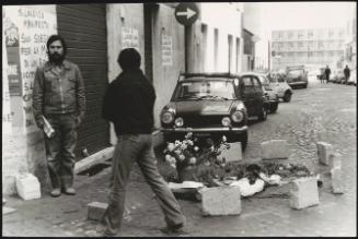 Flowers laid on the ground on Via dei Marrucini (near Sapienza University) Rome, where student Settimio Passamonti was killed in April 1977