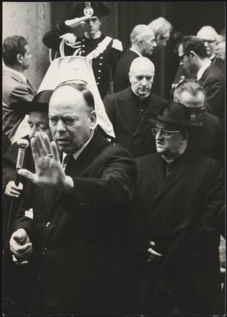Cardinal Alfredo Ottaviani leaving a building.