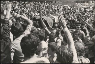 Crowds gather in the street for the funeral of politician Augusto De Marsanich in Bologna.