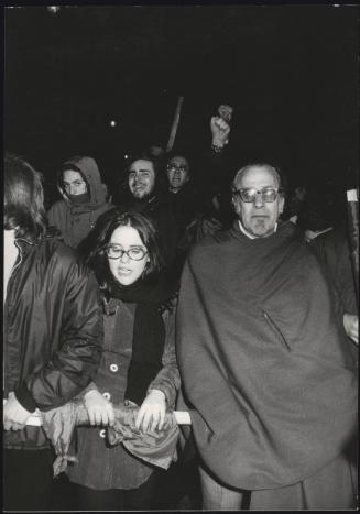 Demonstrators holding wrapped up flags