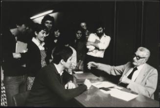 Professor Giuseppe Palomba talks to students