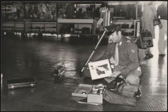 Police officer working as security in an airport