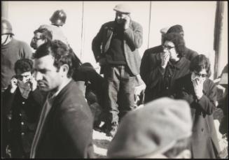People cover their mouths and noses on the street during the aftermath of the Belice eqarthquake in Sicily 