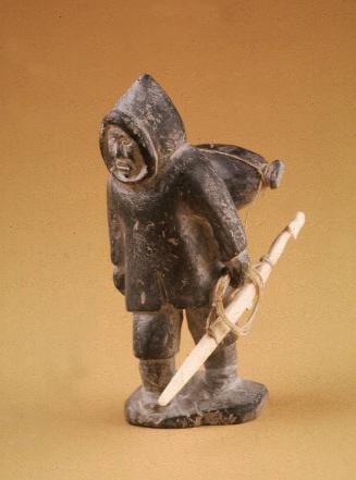 Hunter Carrying a Seal