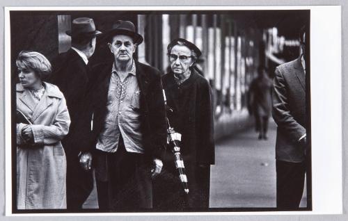 Kansas City, Kansas [Man with hat, woman with umbrella]