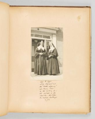 Left to right, Sister Raymond and the "Mother Superior" "St. Charles Bow" on the gallery of the convent in Ste. Famille, Isle Orleans, The convent destroyed by fire. Page 15 of Quebec II; from collection of Canadian albums compiled by Edith S. Watson, 1890s-1930s
