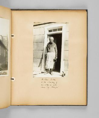Mr. Louis Jobin in the doorway of his shop, in Ste. Anne de Beaupré. Page 63 of Ste Anne de Beaupré; from collection of Canadian albums compiled by Edith S. Watson, 1890s-1930s