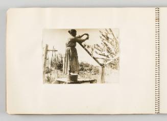 [Woman hanging crops to dry, page 28 of The Doukhobors I album]