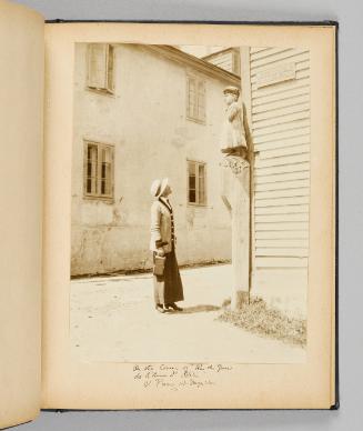 On the corner of "Rue du Quai de L'Amee d'Helia", St. Pierre et Miquelon [Page 29 of Happy Voyages with Queenie album]