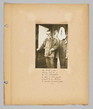 The Doctor of the Hudson Bay Co. at the Pas. demonstrates a pair of sand goggles invented by the Indians to prevent snow blindness [Page 49 of New Canadians album]
