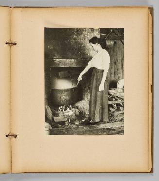 [Woman stirring large pot over fireplace] [Page 29 of Wells and Pots album] 
