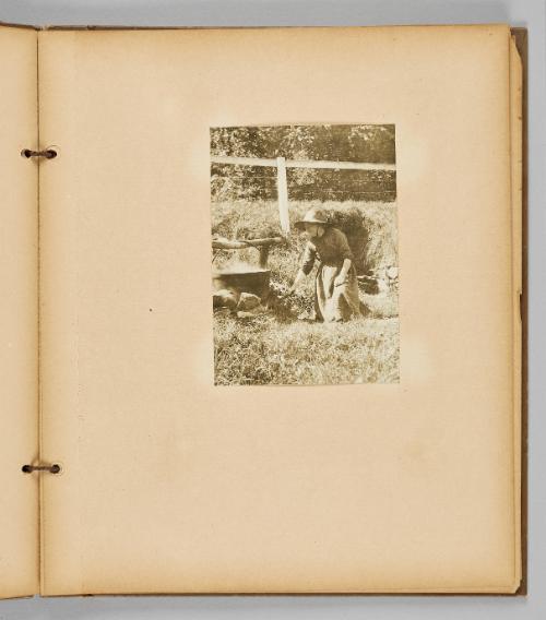 [Woman cooking over big pot outdoors] [Page 27 of Wells and Pots album] 
