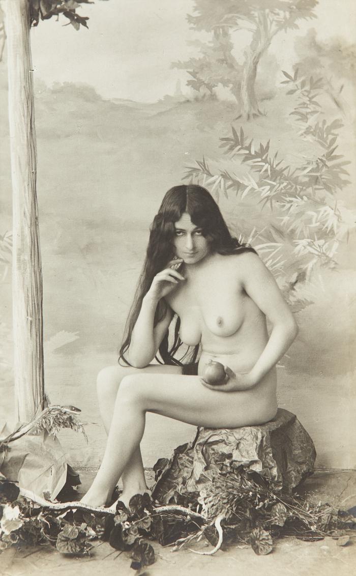 [Woman with long hair holding apple]