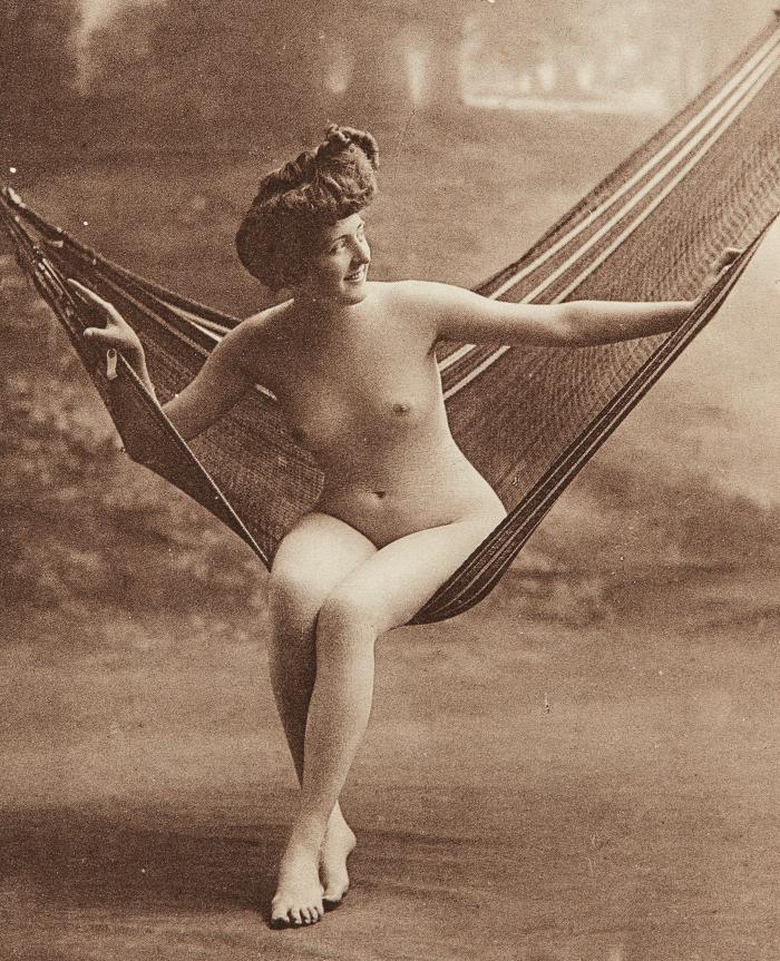 [Woman seated on hammock]