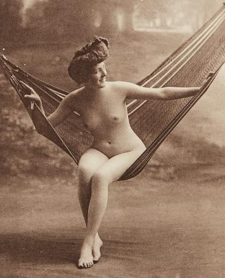 [Woman seated on hammock]