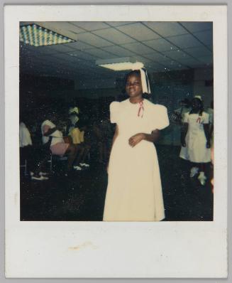 [Teenage girl wearing cancer ribbon]
