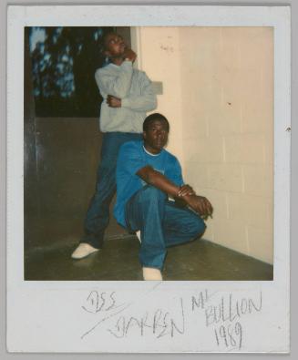 [DSS?] Darren [illeg.] Bullion 1989 [Two men posing outside, man in front is kneeling in a blue t-shirt, man behind is standing in grey sweatshirt]