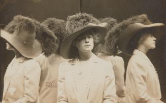 [Young woman with feathered hat]