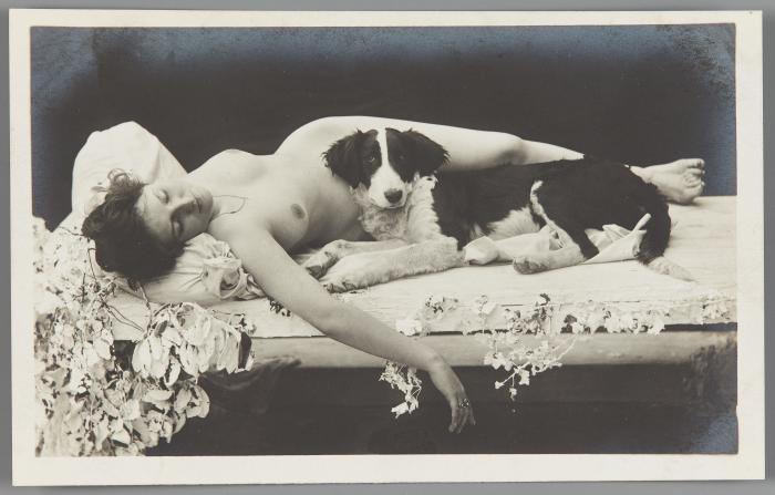[Reclining woman with dog]