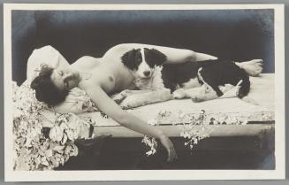 [Reclining woman with dog]