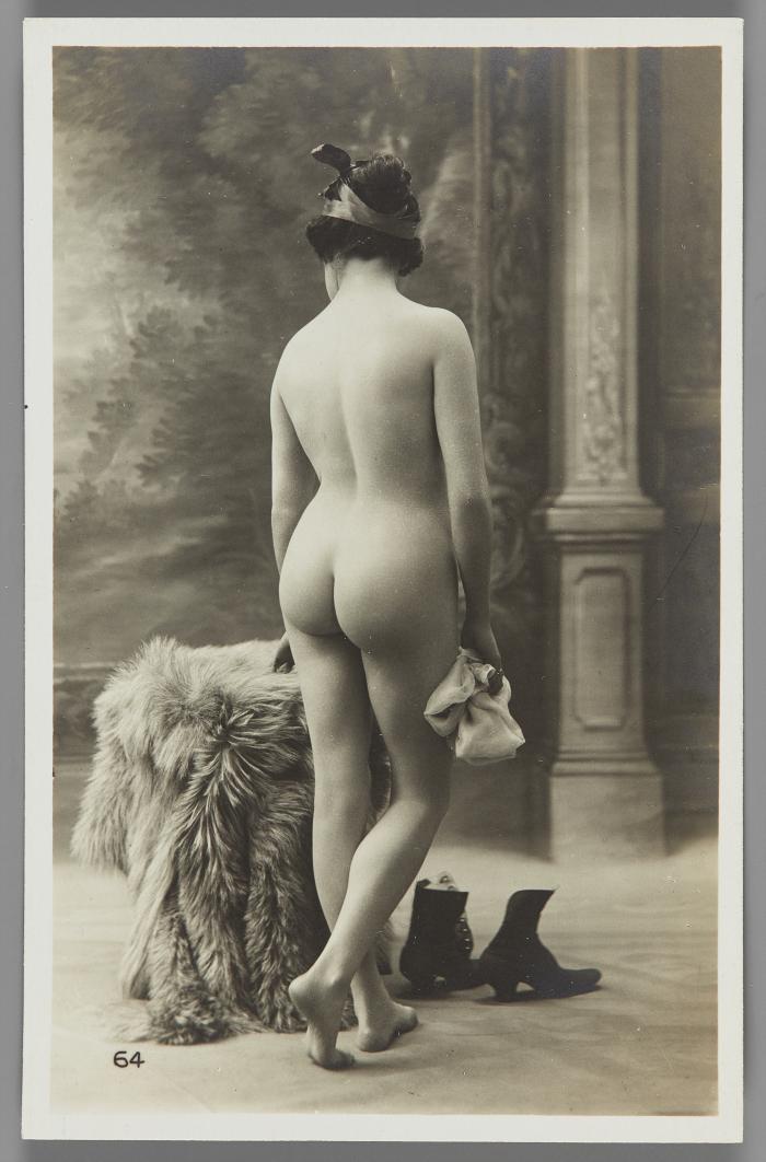 [Woman with boots on floor, back view]