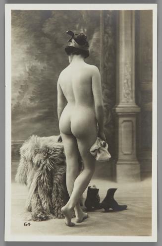 [Woman with boots on floor, back view]