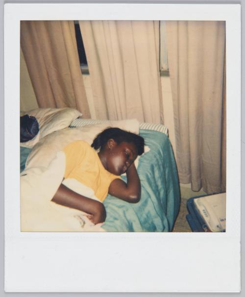 [Girl in yellow tshirt fast asleep in bed]