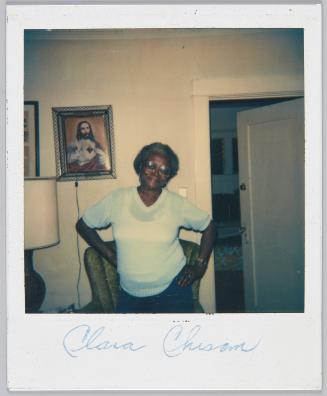 Clara Chisom [Elderly woman posing with her hands on her hips]
