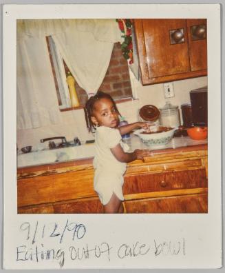 Eating out of cake bowl
