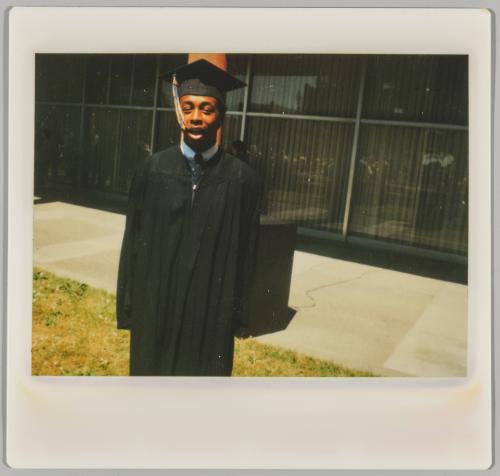 Donald Jones, 6-11-83 [Young man in black graduation cap and gown]