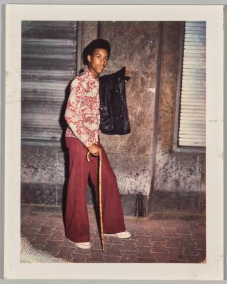 Franfut Germany, Bob Clubiwa, '73 [Man in burgandy walking with cane]