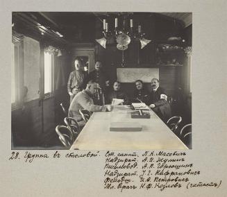 Group in the canteen. Senior medics  P.K Masevich, supervisor A.I Zhulin, clerkA.P Gavrushin, supervisor U.G Nafranovichc, paramedic I.O Petrova, junior doctor N.F Kozlov ( reading)