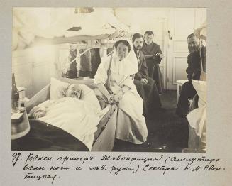 Wounded officer Zhabopritskiy ( both legs and left arm amputated) Nurse N.A Svetnitskaia