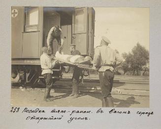 Loading seriously wounded on the train through the open corner