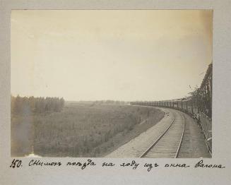 Shot of the train from a moving train  car