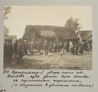 Peasant's house yard where 3 bombs from German airplane fell.
