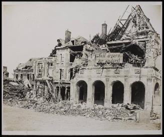 The Fall of Peronne. Wrecked building on the Grande Place, Peronne, showing German notice