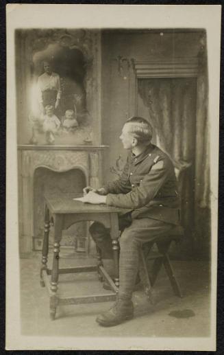 [World War I soldier writing home]